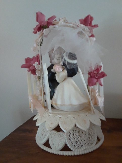 Weddings are the product of their time, just like this cake topper.