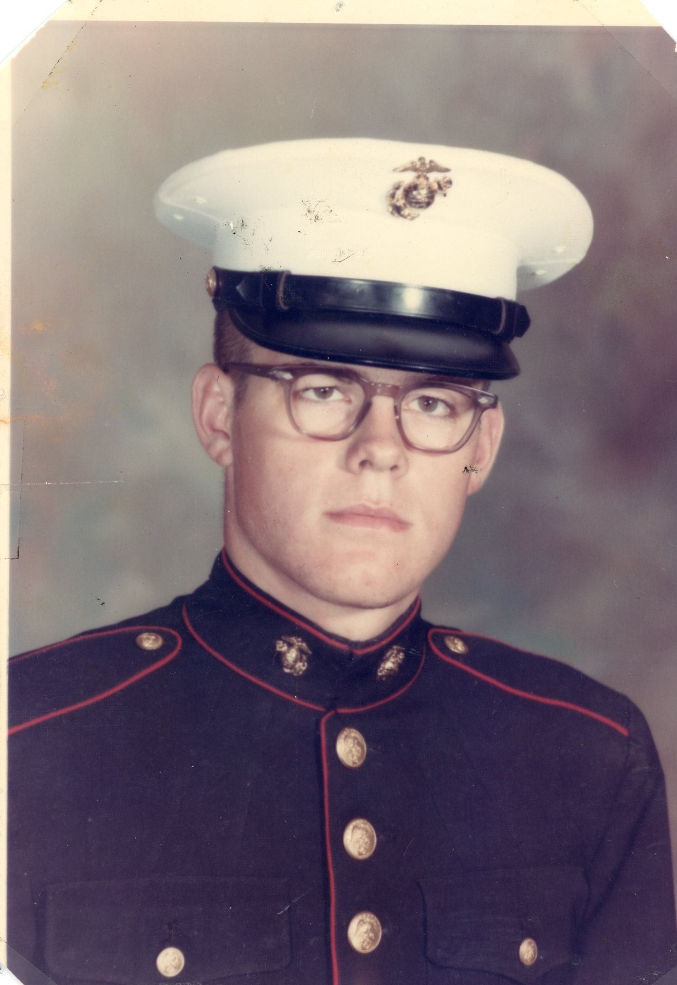 My brother was serious in his USMC uniform.